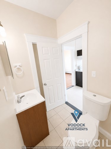A bathroom with a sink, toilet and bathtub.