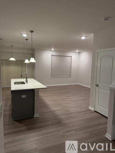 A kitchen area with a sink and a cabinet.