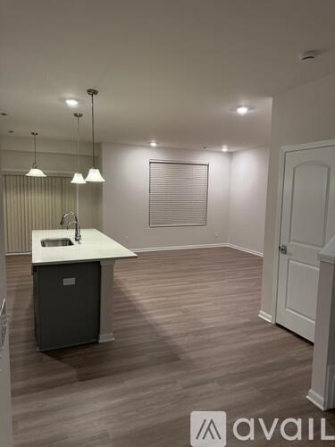 A kitchen area with a sink and a cabinet.