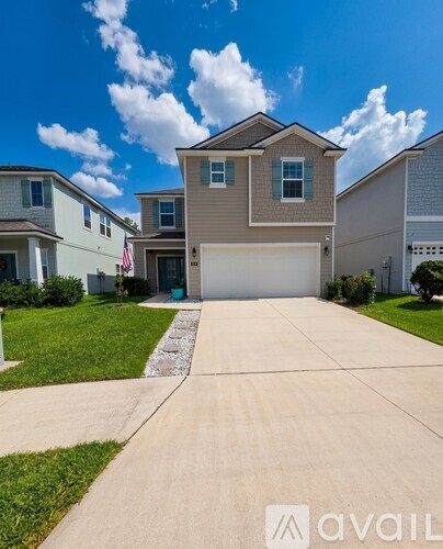 A house with a driveway in front of it.