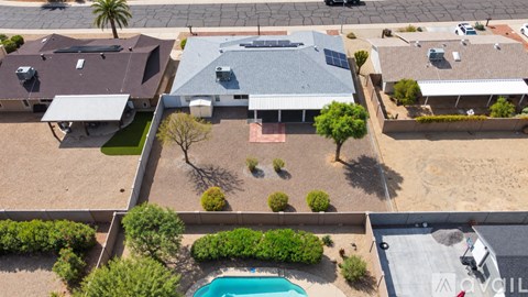 A house with a pool in the backyard.