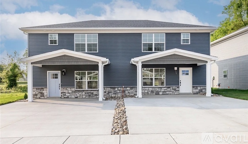 A two-story house with a garage on the first floor.