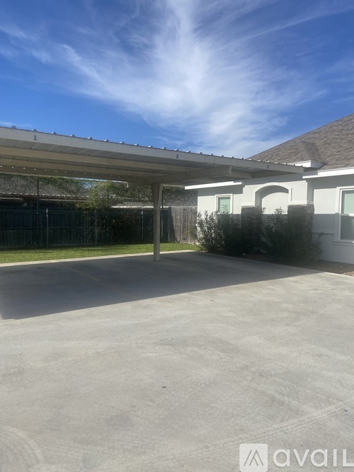 A parking lot with a building in the background.