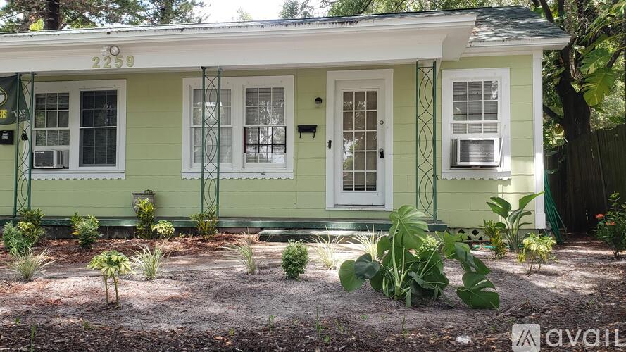 A green house with the number 2259 on the front.