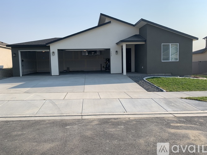 A modern house with a garage and driveway.