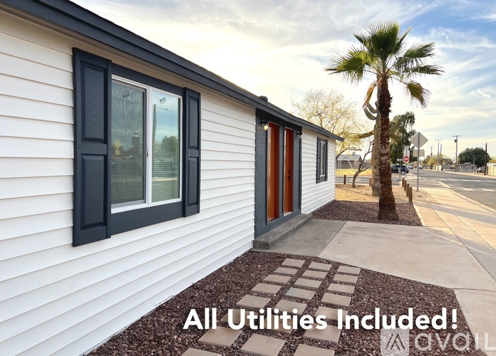 A house with the text "All Utilities Included!" on the image.
