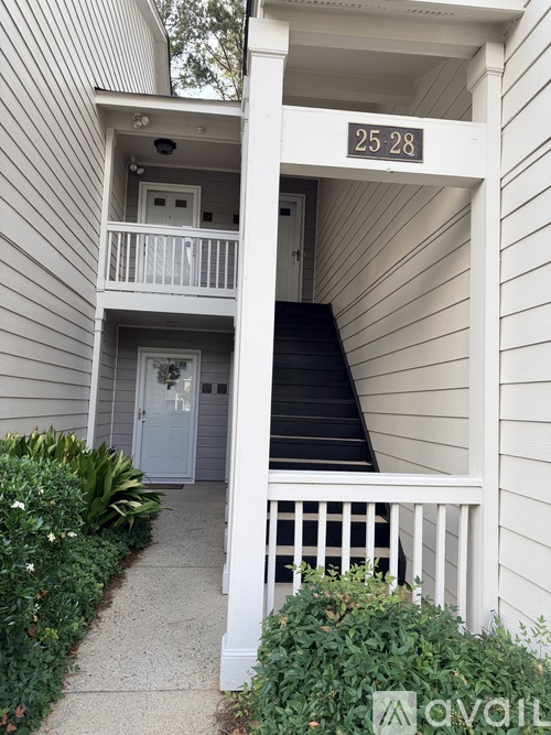A white house with the number 25 28 on the front.