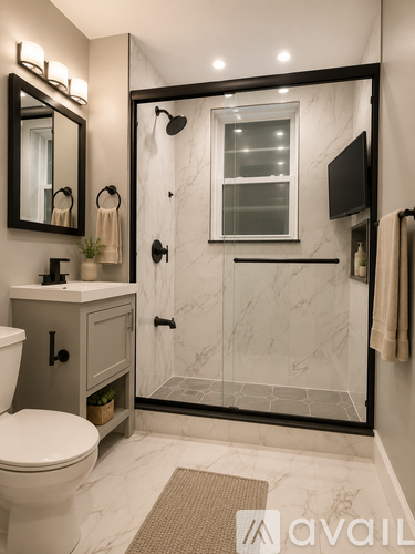 A bathroom with a marble floor and a walk-in shower.