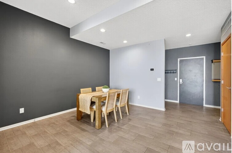 A dining room with a table set for two.