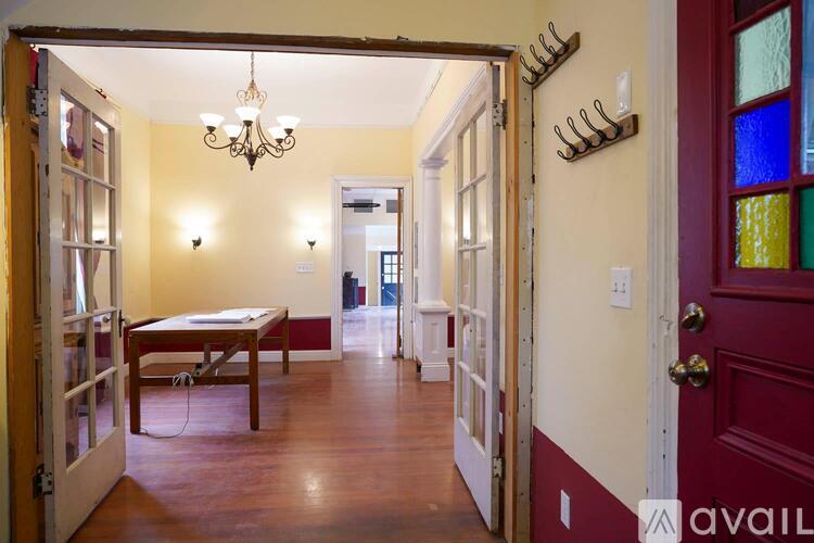 A room with a table and chairs in it.
