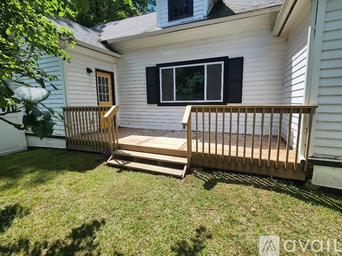A house with a deck and a window.