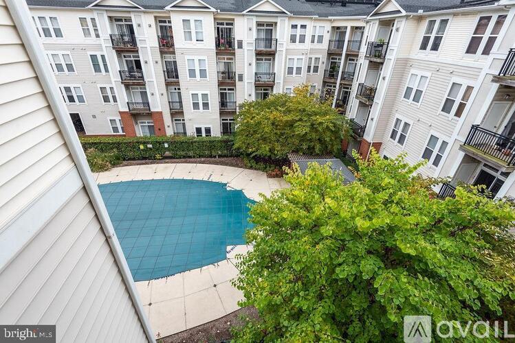 Apartments with a pool in the middle of the courtyard.
