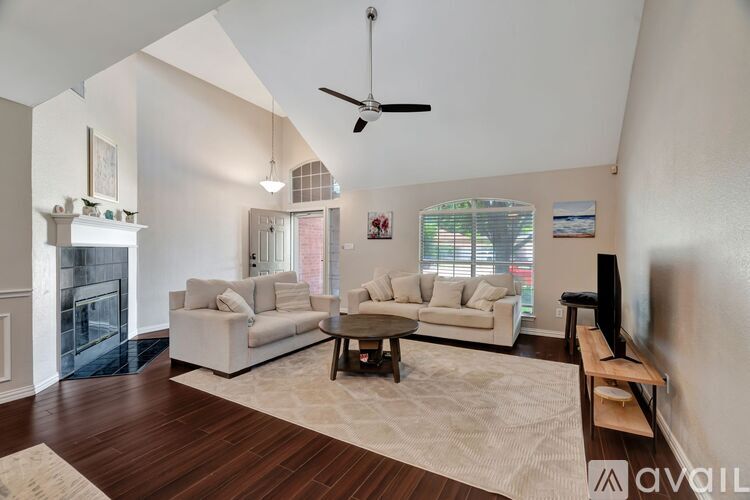 A living room with a fireplace and a couch.