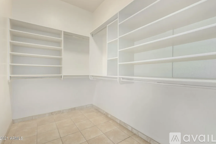 A room with white walls and a tiled floor.