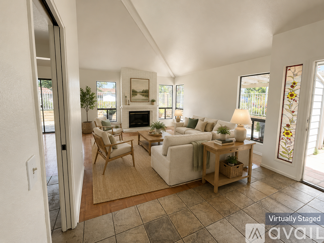 A living room with a fireplace and a couch.