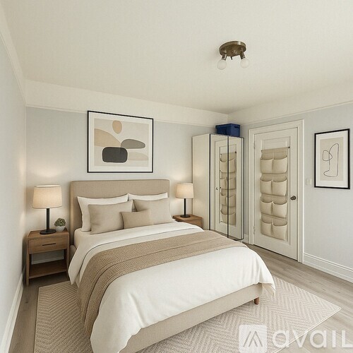 A bedroom with a large bed and a painting on the wall.