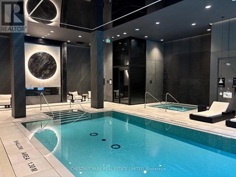 A swimming pool in a modern indoor setting.
