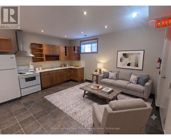 A well-lit kitchen with a dining table and chairs.