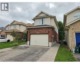 A house with a garage is for sale.