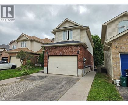 A house with a garage is for sale.