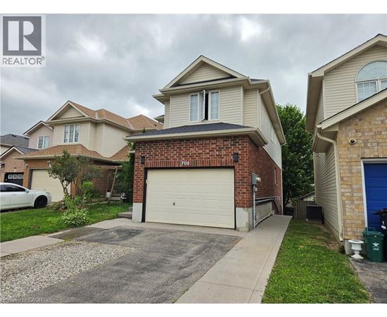 A house with a garage is for sale.