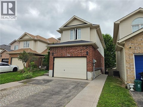 A house with a garage is for sale.