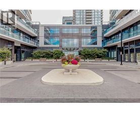 A courtyard with a fountain and a flower arrangement in the middle.