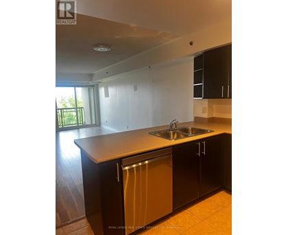 A kitchen with a sink and a dishwasher.