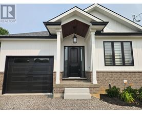 A house with a black front door and a small porch.
