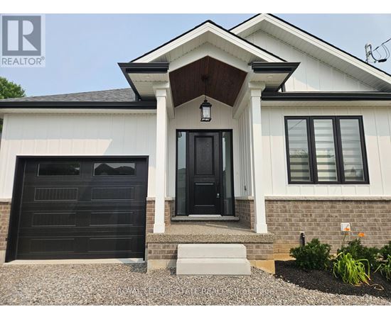 A house with a black front door and a small porch.