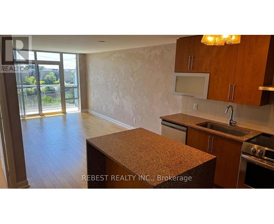 A kitchen with a counter top and cabinets.