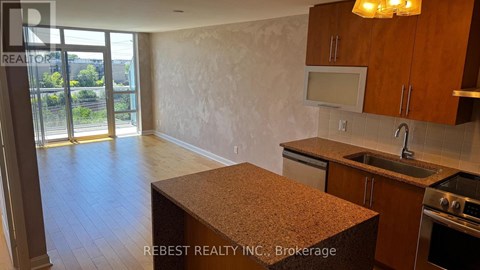 A kitchen with a counter top and cabinets.