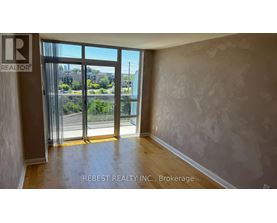 A room with a view of the street through the window.