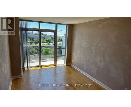A room with a view of the street through the window.