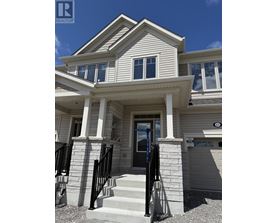 A house with a black door and a small porch.