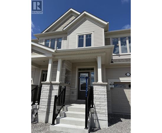 A house with a black door and a small porch.