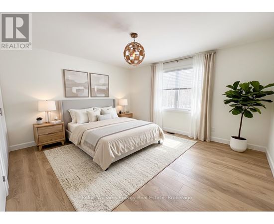 A bedroom with a large bed, a nightstand with a lamp, a window with curtains, and a potted plant.