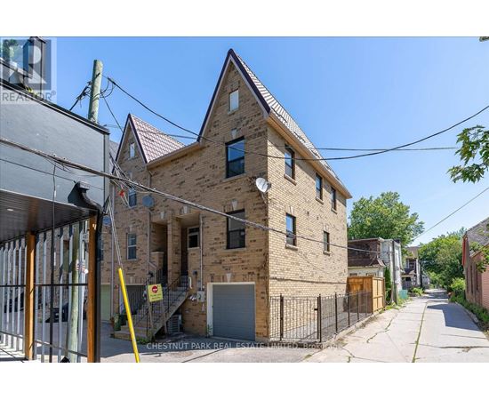 A brick building with a sign that says Chestnut Park Real Estate.