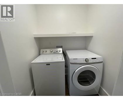 A washer and dryer in a laundry room.