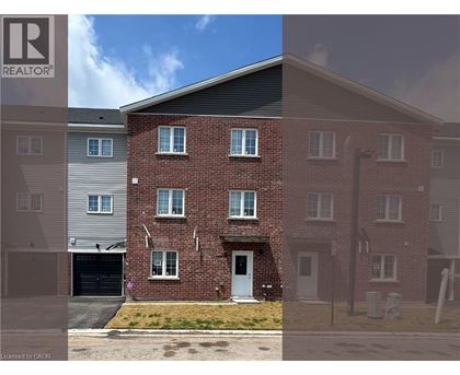 A brick house with a garage is shown in the image.