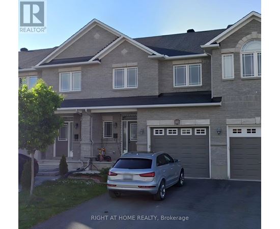 A house with a car parked in front of it.