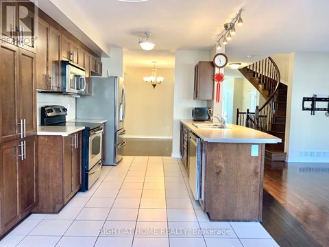 A kitchen with wooden cabinets and a white refrigerator.