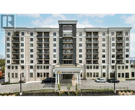 A large building with the words "Wellness Suites" on the front.