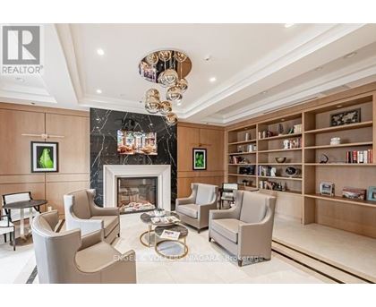A living room with a fireplace and a bookshelf.