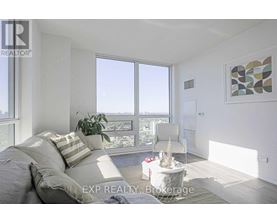 A bedroom with a large bed and a view of the city.