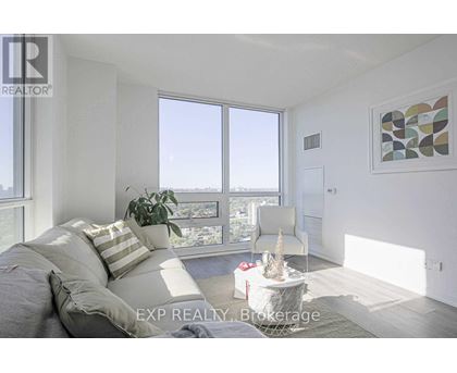A bedroom with a large bed and a view of the city.