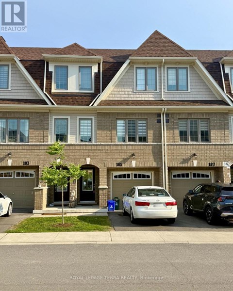 A white car is parked in front of a house with a Royal LePage logo on the bottom left.