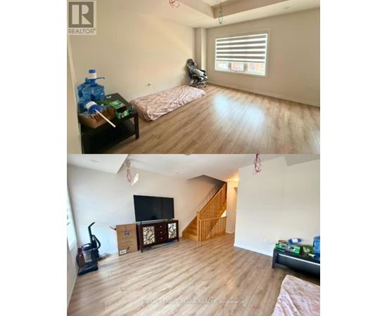 A living room with a couch and a television.