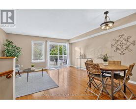 A dining room with a table and chairs is shown.