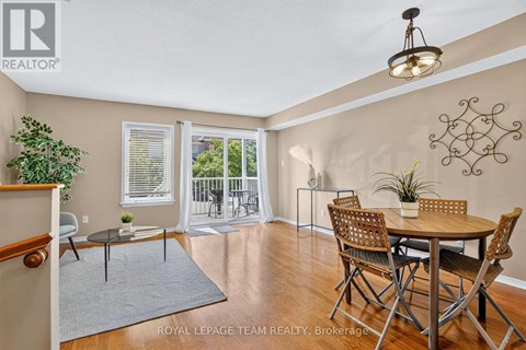 A dining room with a table and chairs is shown.